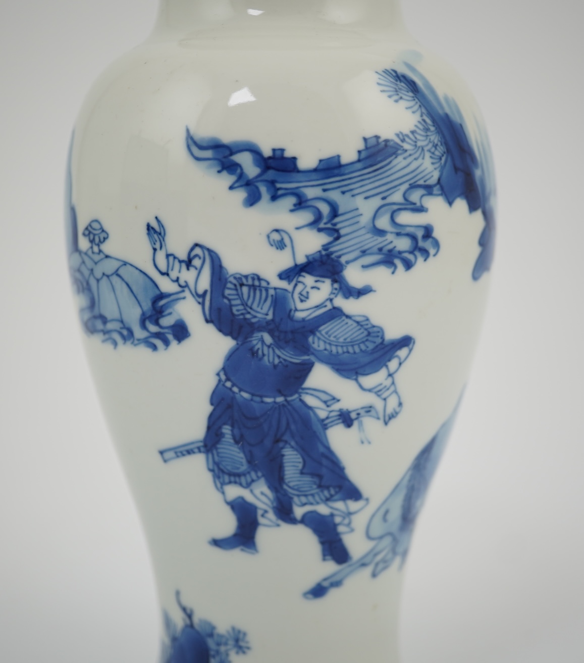 A Chinese blue and white baluster vase, early Kangxi, and associated cover